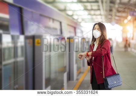Asian Girl Use A Protection Mask For Prevent Pm 2.5 And Corona Viruus Or Covic 19 In Train Station