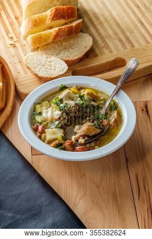 Italian Chicken Sausage Minestrone Soup Au Pistou Topped With Basil Pesto And Grated Parmesan Cheese