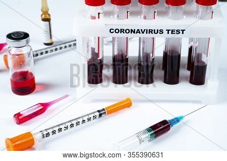 Coronavirus Blood Test Concept. Analyzing Blood Sample In Test Tube For Coronavirus Test. Test Tube