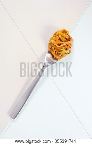 Spaghetti Wound On Fork On Double Color Background On Diagonal Line Of Frame. Classic Spaghetti With
