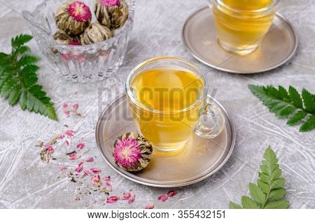 Green Tea Bud With A Red Flower
