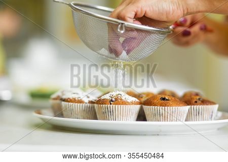 Confectioner Sprinkles Freshly Baked Muffins With Icing Sugar. Sweet Pastries, Recipes, Cooking