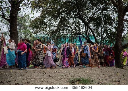 Mayapur, West Bengal, India - March 5, 2020. International Group Of Pilgrims In National Clothes Sar