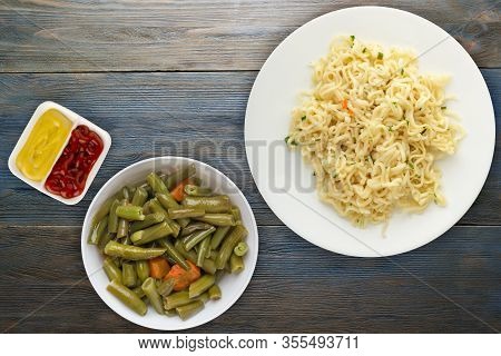 Vermicelli On A White Plate On Blue Wooden Background. Vermicelli On A Plate With Vegetarion Salad T
