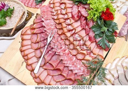 Party Meat Catering Table. Wedding Decorative Ham Slices. Various Meat Snacks Background. Salami Sli