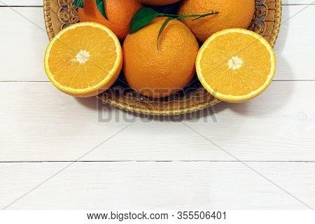 Orange Fruits On A Wooden Table. Healthy Food. Orange On A Tray.