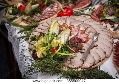 Party Meat Catering Table. Wedding Decorative Ham Slices. Various Meat Snacks Background. Salami Sli
