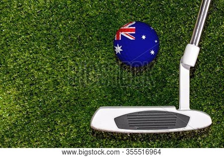 A Golf Club And A Ball With Flag Australia During A Golf Game.