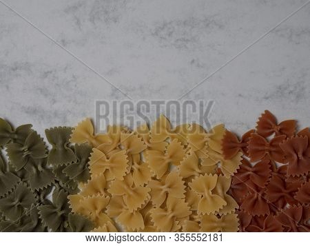 Traditional Italian Farfalle Pasta In National Flag Tricolor Style On Gray Background With Copy Spac