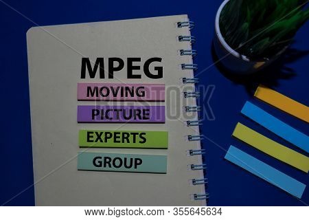 Mpeg - Moving Picture Experts Group Acronym Write On Sticky Note Isolated On Office Desk.