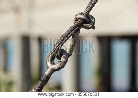 Stainless Steel Turnbuckle Hook And Steel Wire Cable Rope Connection Ties And Connections Concept. B