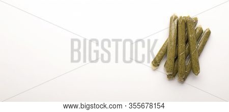 Organic Protein Sources. Green Meatless Sausages Isolated On White Background, Free Space