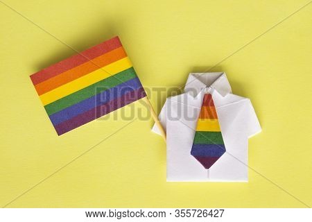 Lgbt Flag And Figure Of Man. Shirt Made Of Paper With Colour Tie, Origami. Symbol Of Gays And Lesbia