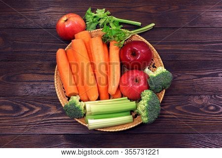Fresh Vegetables And Fruits On A Wooden Table. Healthy, Vegetarian Food. Natural Vitamins. Carrot, B