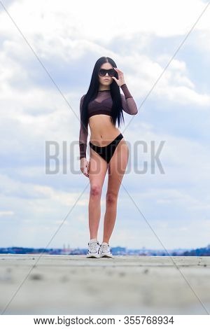 Abs. Freedom. Sensual Girl In Underwear Lingerie And Sunglasses Outdoor. Sexy Woman With Fit Body. S