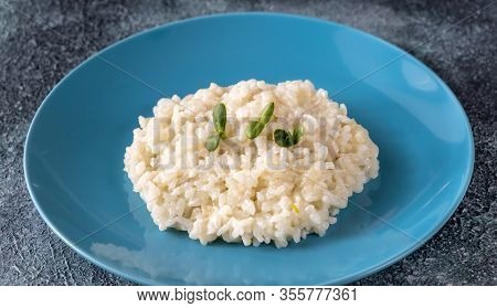 Portion Of Classic Italian Risotto On Blue Plate