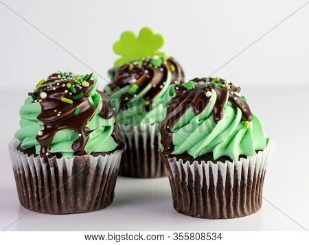St. Patrick’s Day Chocolate Mint Frosted Cupcakes With Chocolate Drizzle And Sprinkles And A Four Le
