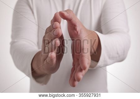 Young Asian Man Wearing White Shirt, Happy Proud Clapping Gesture.over Grey Background, Halfl Body P
