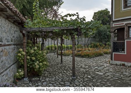 Panagyurishte, Bulgaria - September 07, 2011:  Yard With Fragment Of Old House With Interestingly Ar