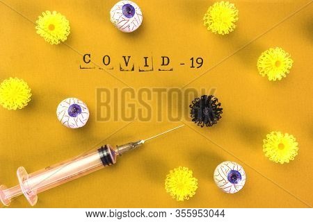 Syringe Vaccine Of Virus Convid 19 In Yellow Background