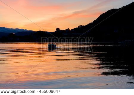 Norwegian Fjords Sunset Mountain Night Picturesque Landscape With Sailing Boat, Rosendal.