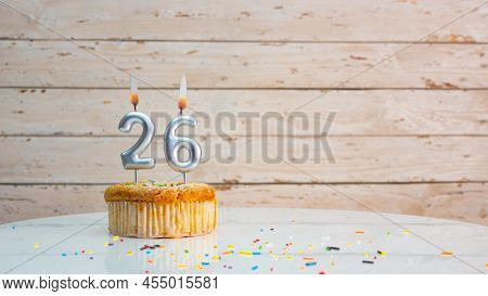 Happy Birthday Greetings For 26 Years Old From Silver Numbers Against The Background Of White Boards