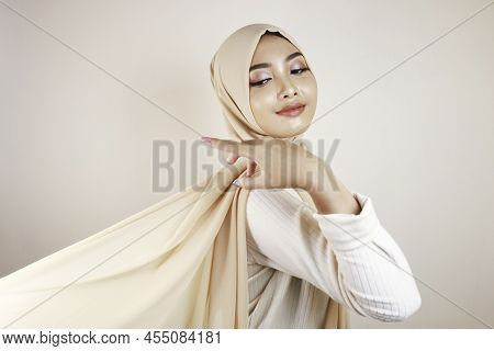 Muslim Woman Wearing Traditional Wear And Hijab Isolated On White Background. Hijab Is Creatively Ma