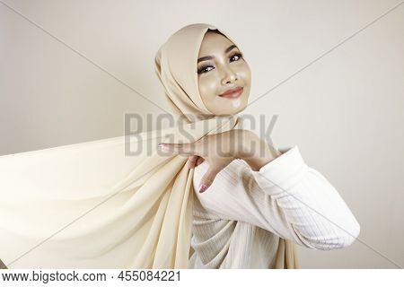 Muslim Woman Wearing Traditional Wear And Hijab Isolated On White Background. Hijab Is Creatively Ma