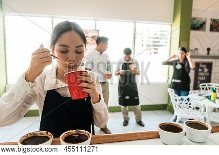 Professional Coffee Cupper Doing An Examination Of A Specialty Cup