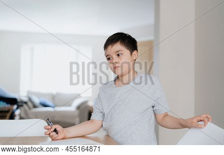 Portrait Young Boy Holding Black Pen Looking Deep In Thought, School Kid Looking Out With Thinking F
