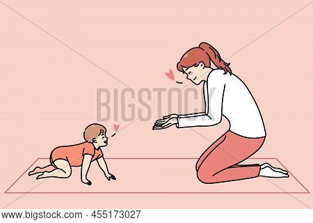 Loving Happy Young Mother Play With Little Toddler Crawling At Home. Smiling Caring Mom Have Fun Tea