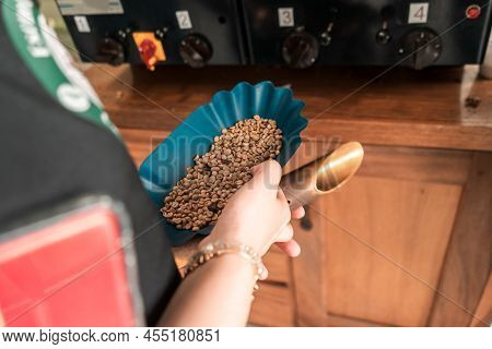 Close Up Of A Professional Coffee Cuppers Hand Holding A Tray For Roasting