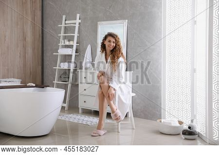 Beautiful Woman Wearing Soft White Robe In Bathroom