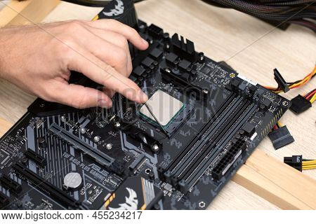 Close Up Of Man Installing Computer Processor Chip, Ryzan Microprocessor. Maintenance Computer Cpu H