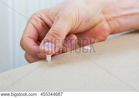 Professional Furniture Assembly Worker Assembles Shelf. Furniture Assembly Process. Diy Assembling