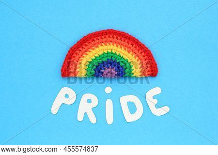 Crochet Rainbow Colors And Pride Lettering On Blue Background. Lgbt Flag Gay Pride Community, Equal 