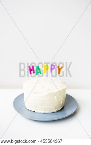 Birthday Cake, On A Creamy Sponge Cake The Inscription Happiness. The Concept Of The Holiday And Bir
