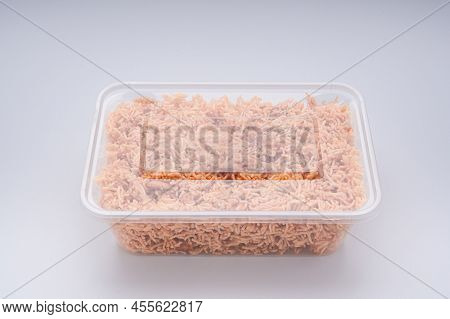 Package For Sale Of Sweet And Sour Crispy Noodles Or Mee Krob In The Thai Language Placed On A White