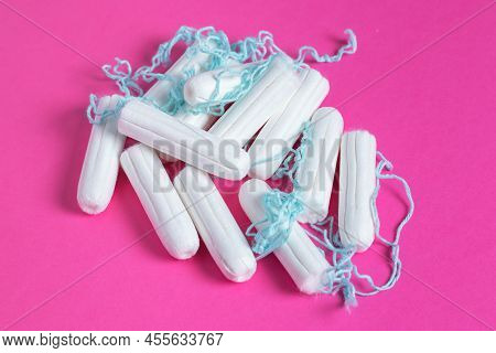 Medical Female Tampon Close Up On A Pink Background. Hygienic White Tampon For Women. Cotton Swab. M