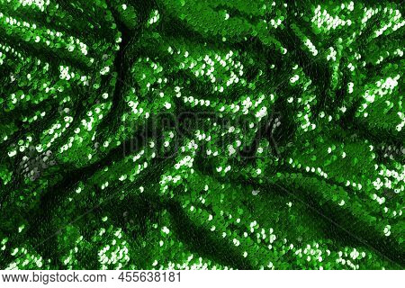 Abstract Festive Background With Green Sequins For Holiday And Party Banner. Glamour Shiny Backgroun