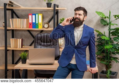 Reimagined Mobile Experience. Happy Man Talk On Phone In Office. Mobile Communication
