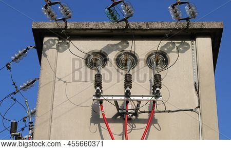Detail Of The High Voltage Electrical Cables In The Substation With Insulators And Powerlines