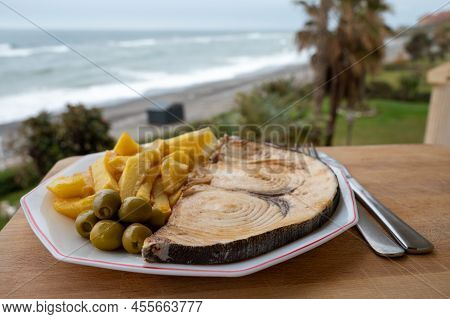 Seafood Dish Served In Beach Cafe With Sea View, Grilled Steak From Swordfish Or Spada Served With F