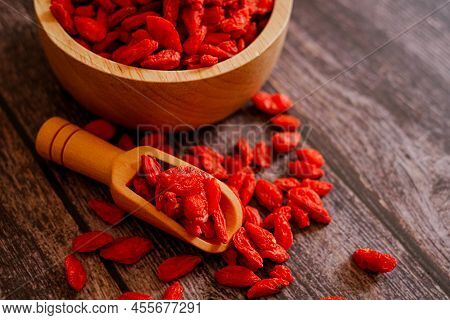 Dried Chinese Wolfberries Or Goji Berry Chinese Herb Or Matrimony Vine In The Woodden Scoop On Woode