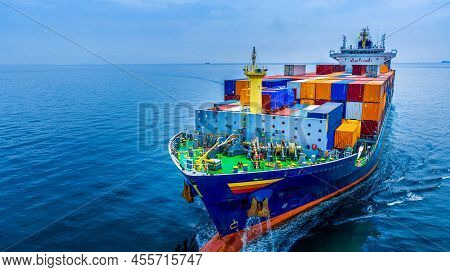 Aerial In Front View Of Cargo Ship Carrying Container And Running For Export  Goods  From  Cargo Yar