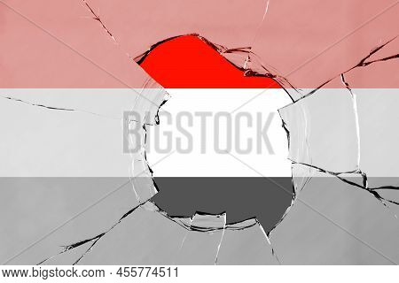 Flag Of Yemen On A On Glass Breakage.