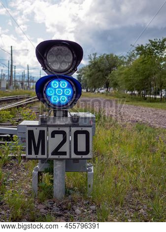 Small Two-sections Railway Shunting Semaphore With A Colorlight Signals Near The Railway Tracks. Blu