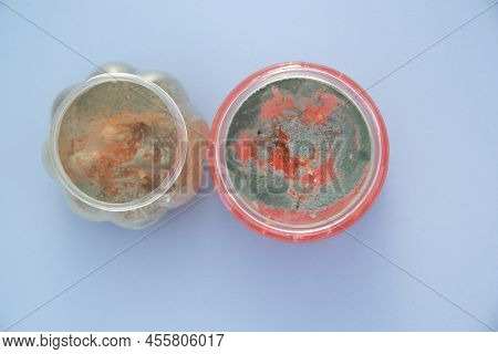 Two Cans Of Spoiled Slime. Theres Mold At The Top
