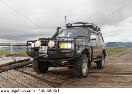 Orkhon Valley, Mongolia - August 02 2018: Toyota Land Cruiser On A Hazardous Wooden Bridge Crossing 