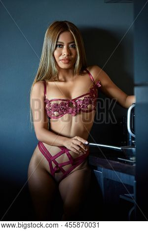 Asian Woman In Dark Red Sexy Lingerie Posing At The Kitchen